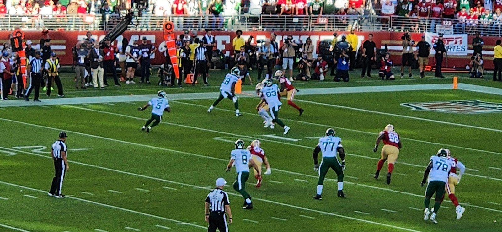 A group of people playing a game of football